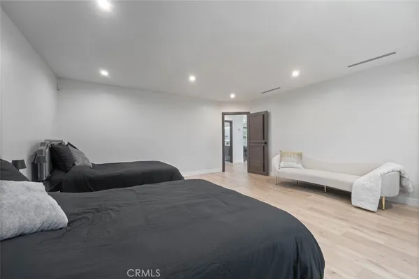 a bedroom with bed and window