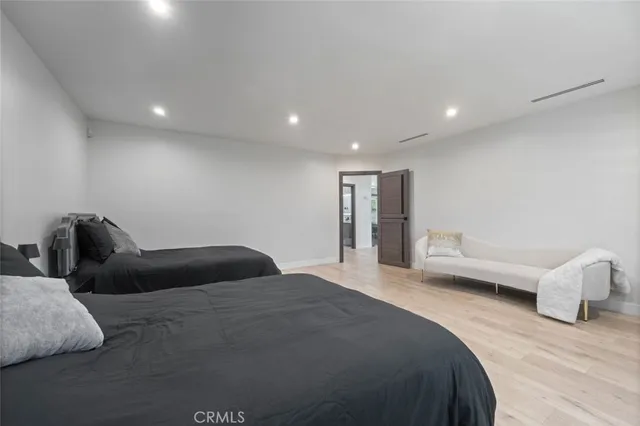 a bedroom with bed and window