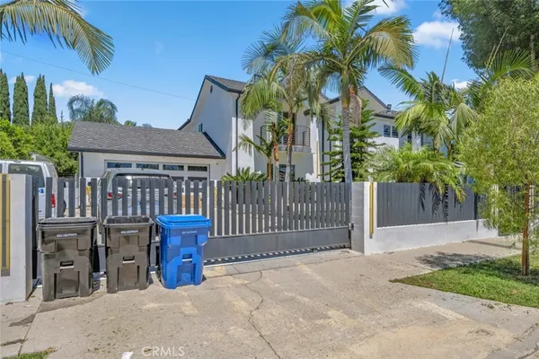 a front view of house with yard outdoor seating and barbeque oven