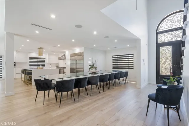 a large kitchen with a table and chairs