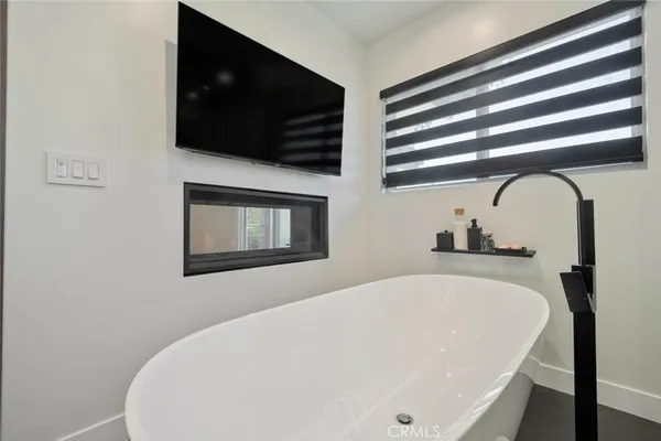 a white bath tub sitting in a bathroom