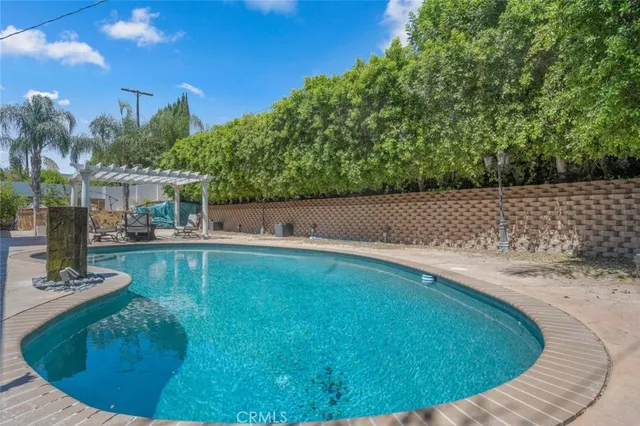 a view of a swimming pool with a patio