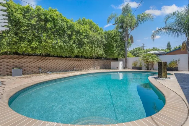 a patio with table and chairs