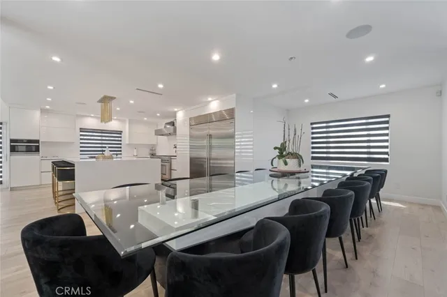 a dining room with furniture and wooden floor