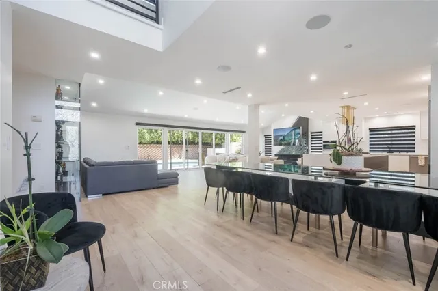 a kitchen with a table chairs stove and kitchen island