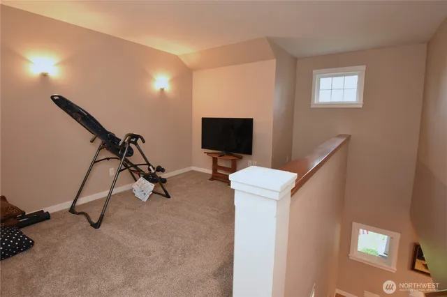 a view of a livingroom with furniture and a flat screen tv