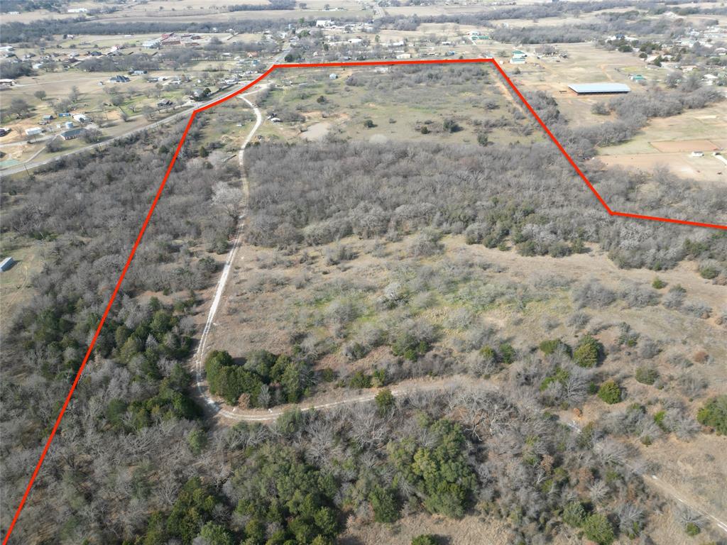 161 East Reno Road Azle, TX 76020 - Photo 12 of 14 a view of a dry yard with lots of bushes