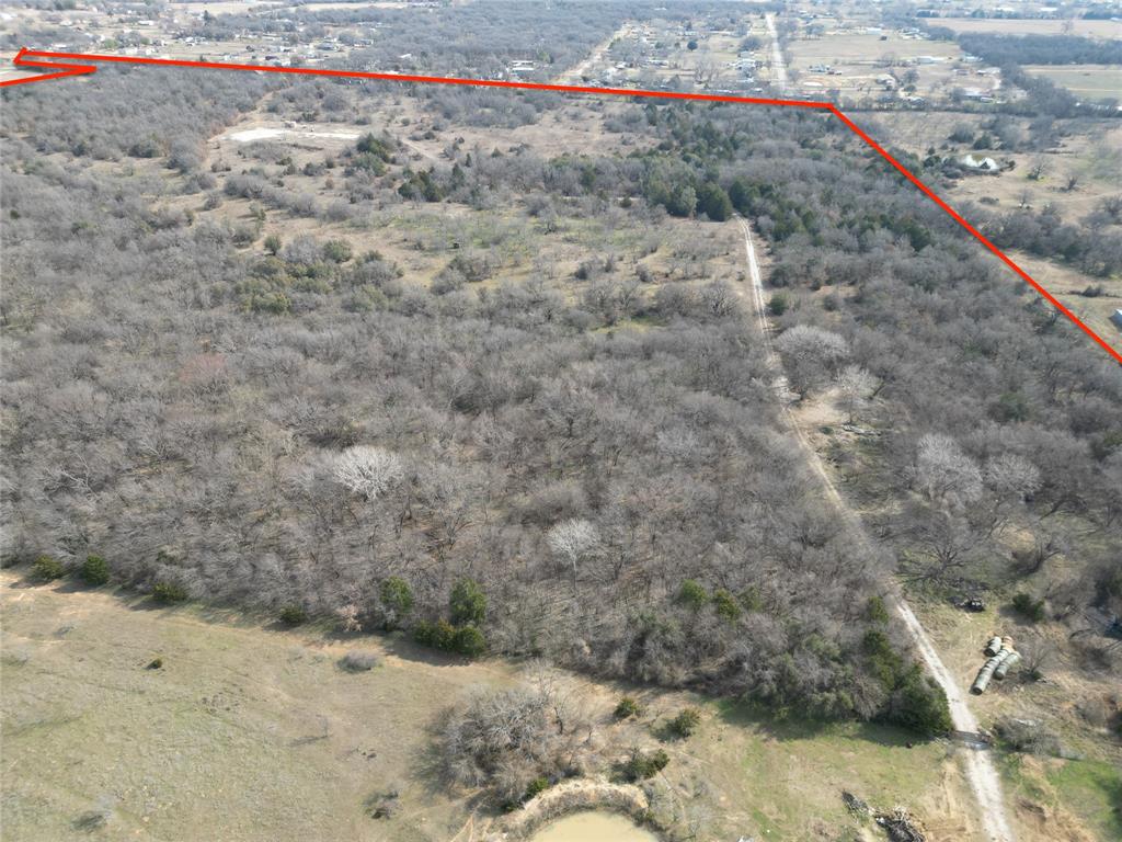 161 East Reno Road Azle, TX 76020 - Photo 7 of 14 a view of a dry yard with wooden fence