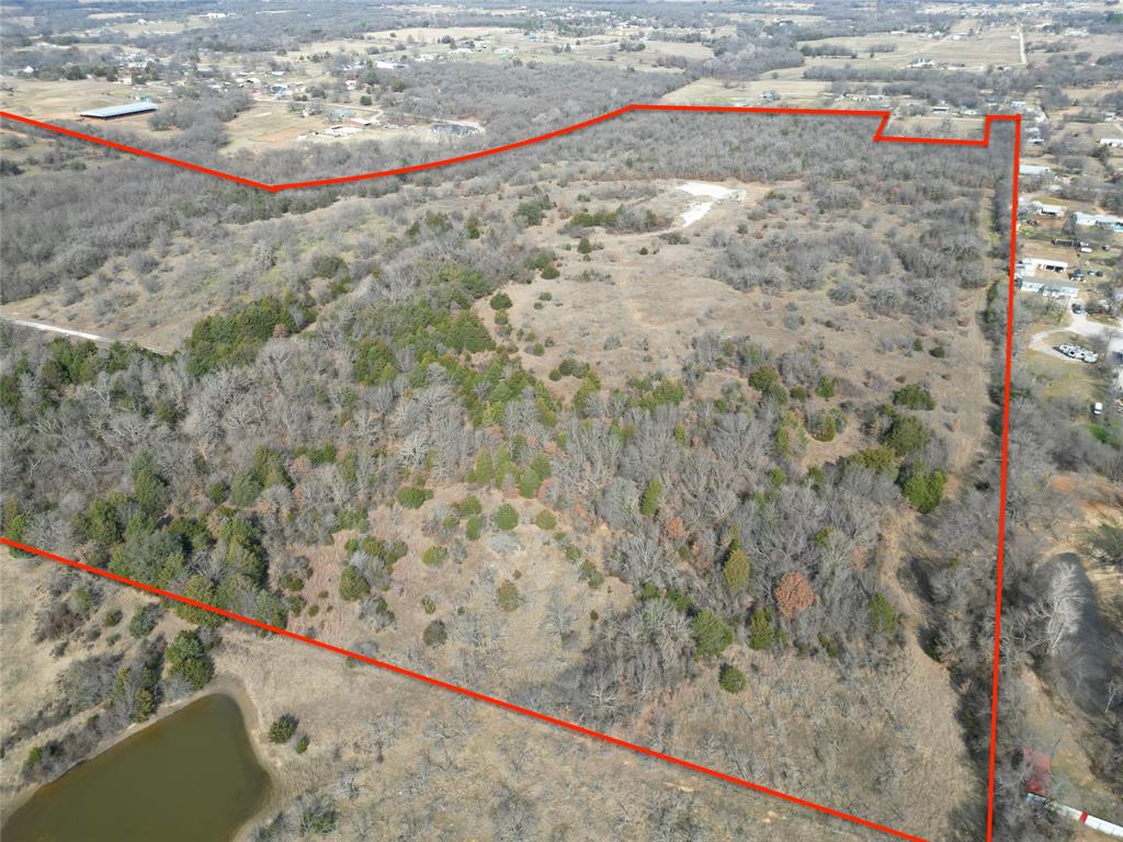 161 East Reno Road Azle, TX 76020 - Photo 9 of 14 a view of a dry yard with wooden fence