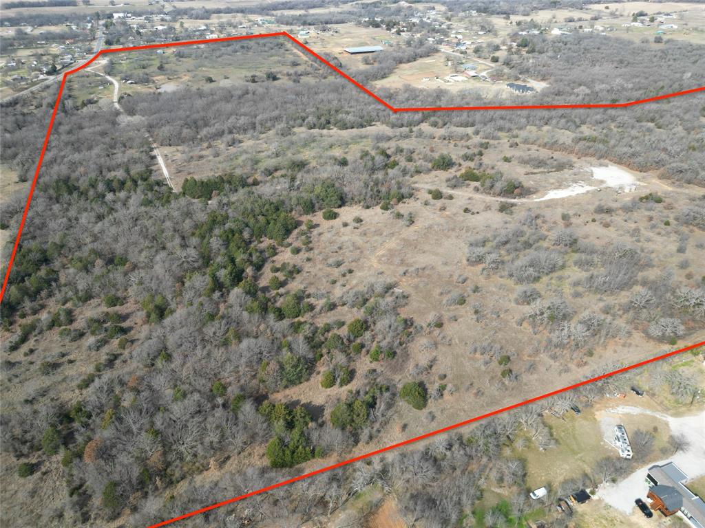 161 East Reno Road Azle, TX 76020 - Photo 10 of 14 a view of a dry yard with wooden fence