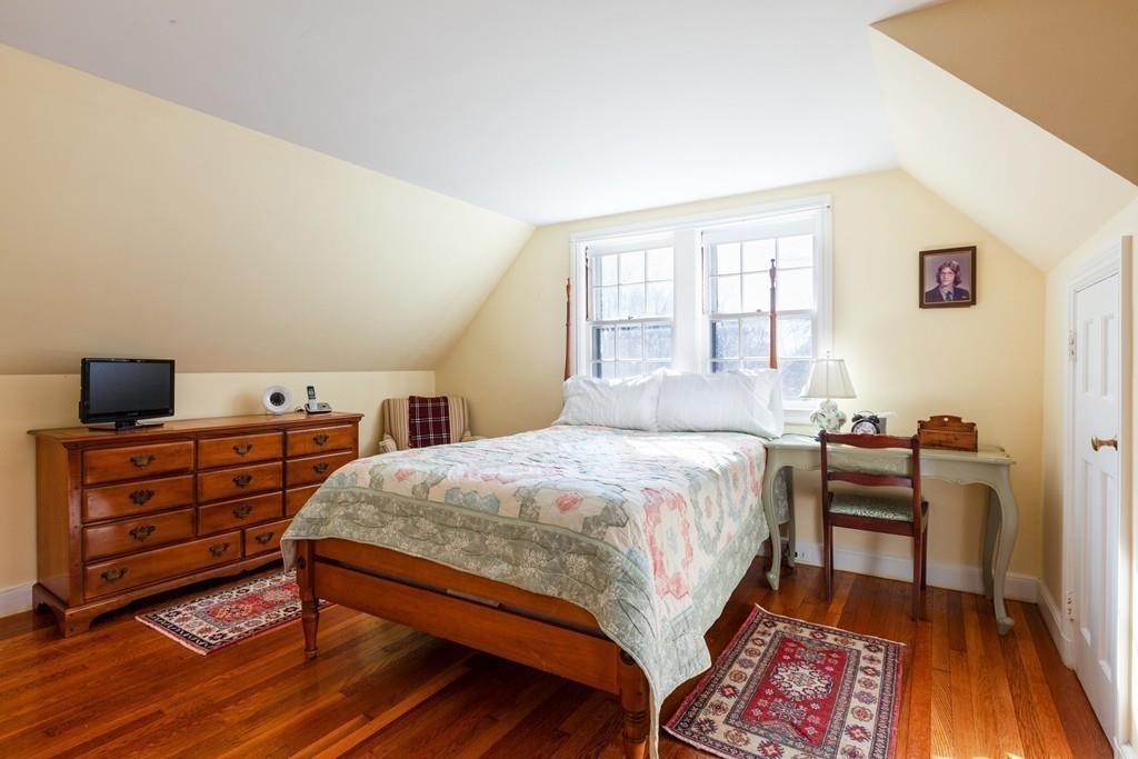 1 Standish Road Wellesley, MA 02481 - Photo 12 of 29 a bedroom with a bed and wooden floor