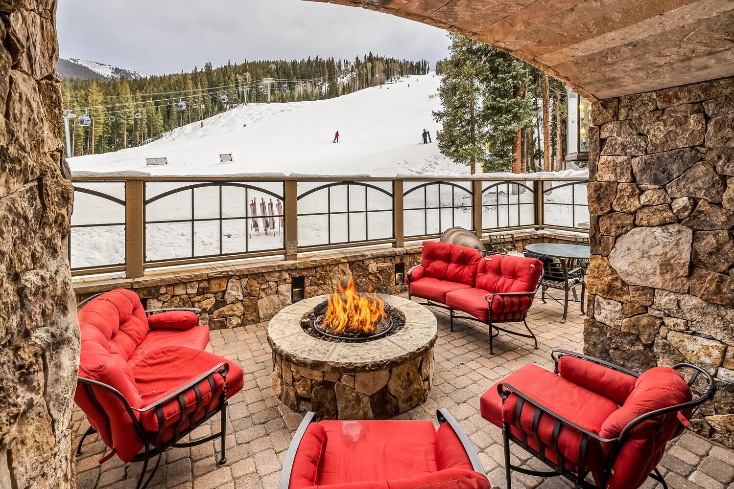 280 Trailhead Drive, Unit 3039 Keystone, CO 80435 - Photo 1 of 38 an outdoor sitting area with a couch and a table