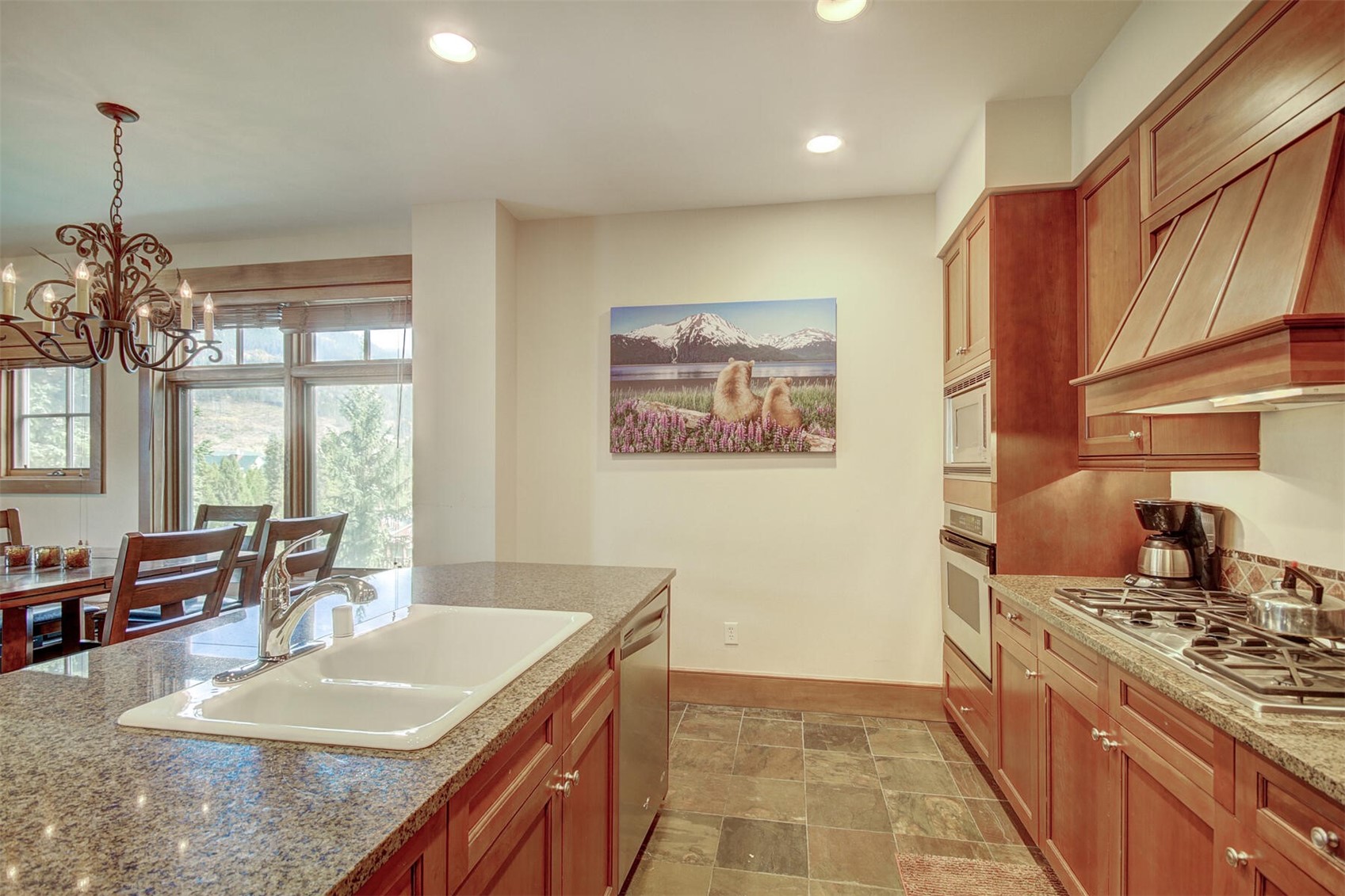 280 Trailhead Drive, Unit 3039 Keystone, CO 80435 - Photo 12 of 38 a kitchen with stainless steel appliances granite countertop a sink stove and cabinets