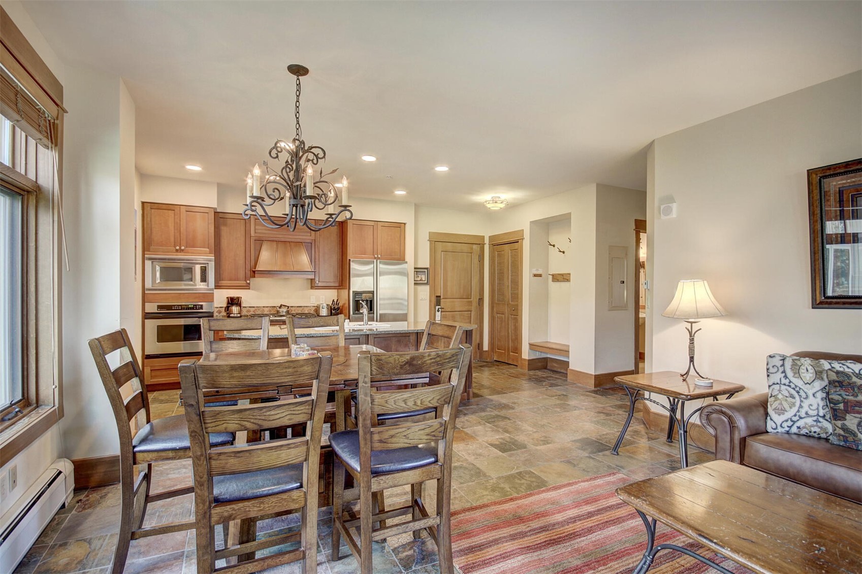 280 Trailhead Drive, Unit 3039 Keystone, CO 80435 - Photo 15 of 38 a view of a dining room with furniture and chandelier