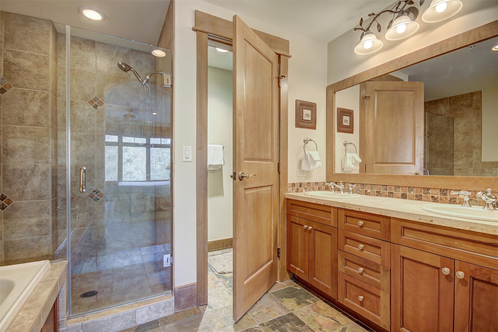 280 Trailhead Drive, Unit 3039 Keystone, CO 80435 - Photo 18 of 38 a bathroom with a shower sink and mirror