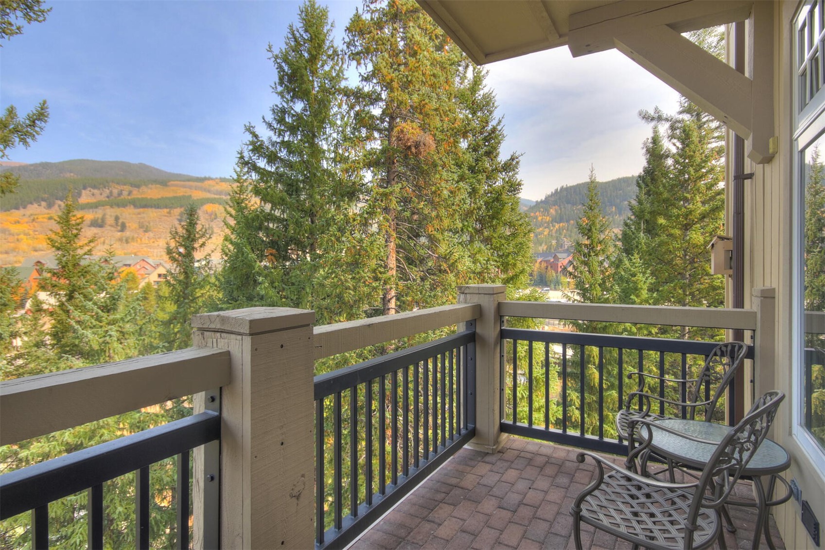 280 Trailhead Drive, Unit 3039 Keystone, CO 80435 - Photo 2 of 38 a view of a balcony with wooden floor and fence