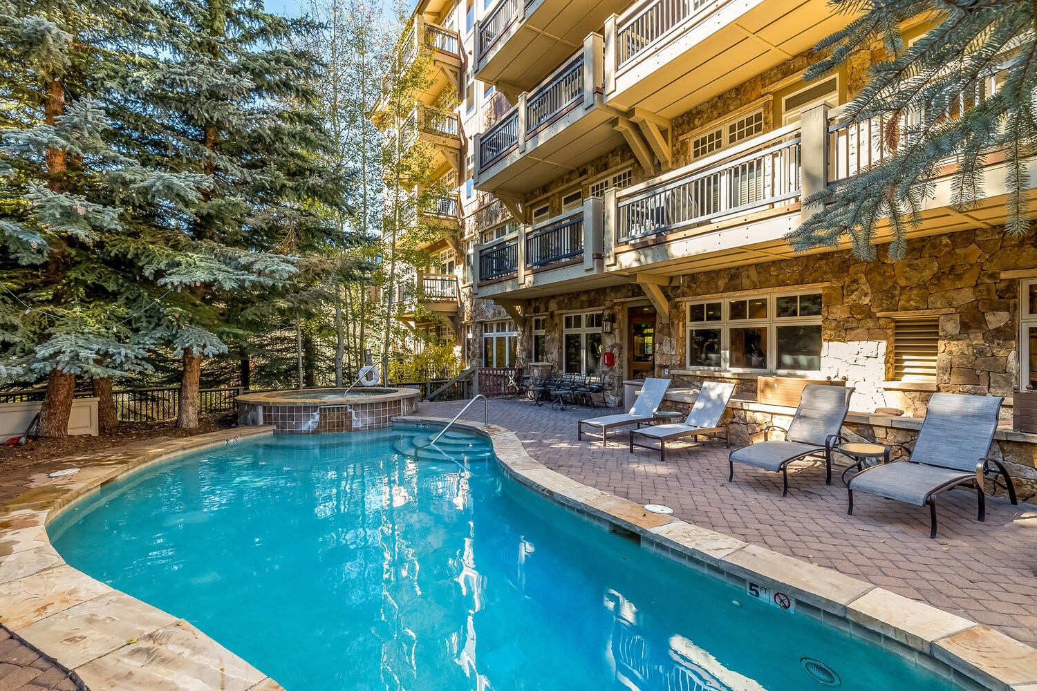 280 Trailhead Drive, Unit 3039 Keystone, CO 80435 - Photo 26 of 38 a view of a swimming pool with sitting area