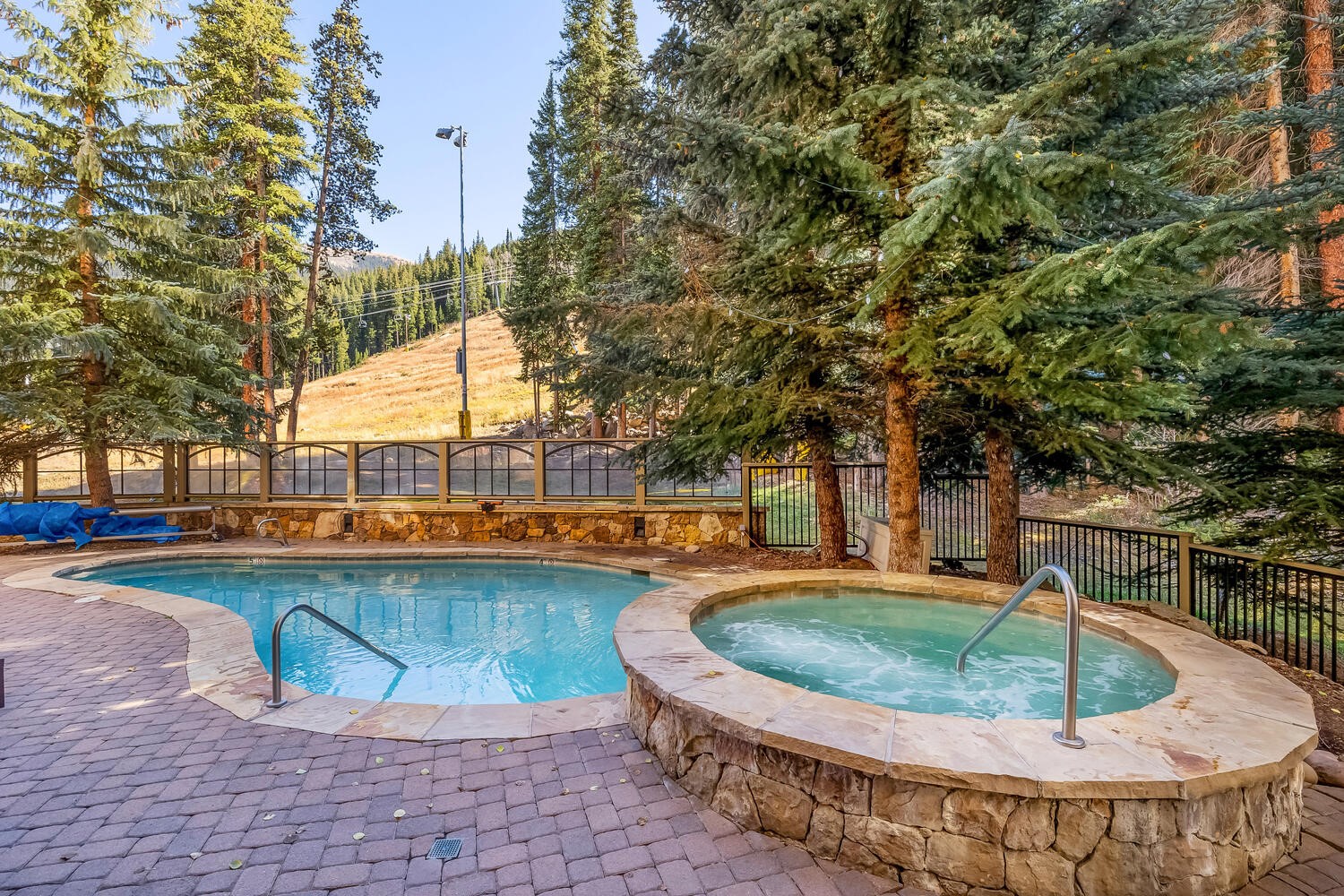 280 Trailhead Drive, Unit 3039 Keystone, CO 80435 - Photo 27 of 38 a view of a swimming pool with a sitting space