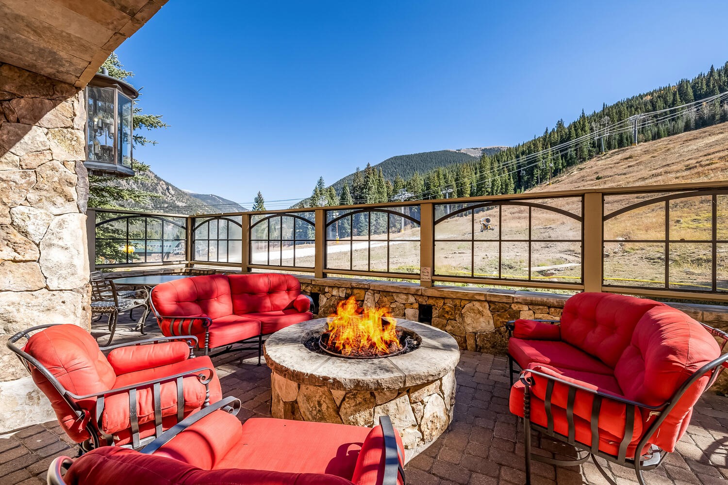 280 Trailhead Drive, Unit 3039 Keystone, CO 80435 - Photo 33 of 38 a blue swimming pool with an outdoor seating space