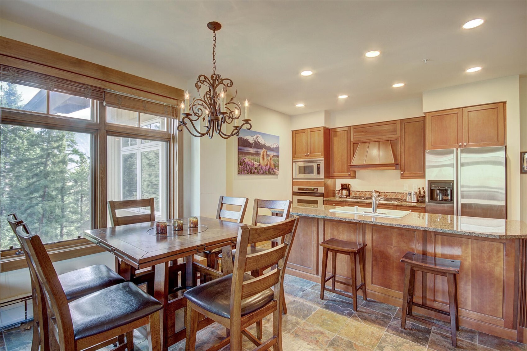 280 Trailhead Drive, Unit 3039 Keystone, CO 80435 - Photo 9 of 38 a dining room with furniture a chandelier and wooden floor
