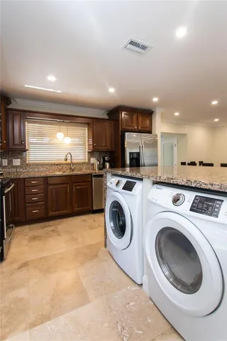 a view of kitchen and washer and dryer