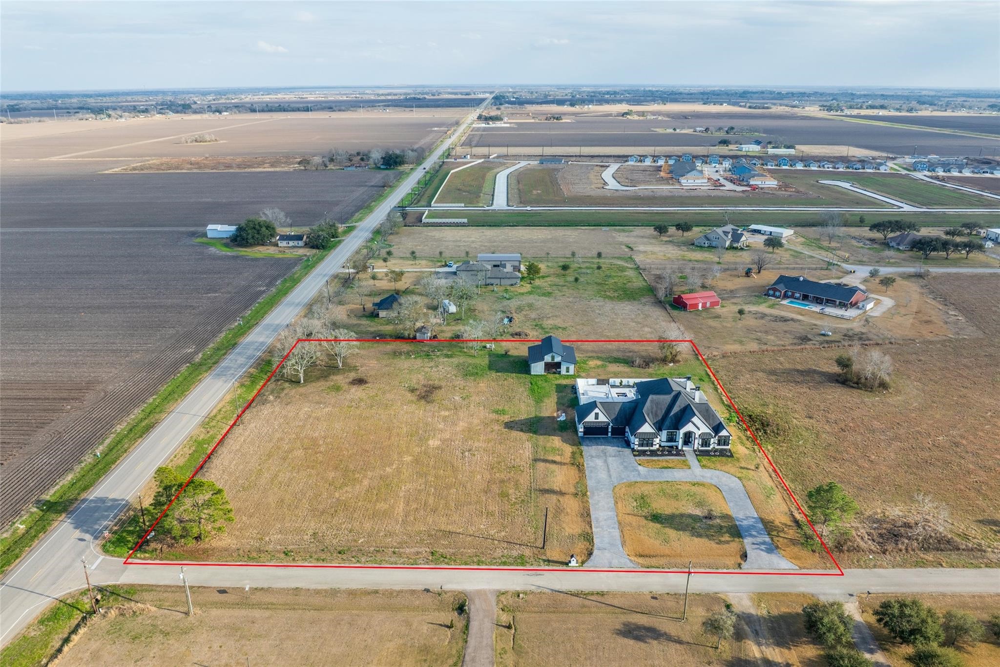 4821 Walters Road Richmond, TX 77469 - Photo 14 of 50 Situated on 3.117 unrestricted acres, this aerial view illustrates the property’s impressive size, open land, and potential for agricultural, residential, or commercial use (buyer to verify)