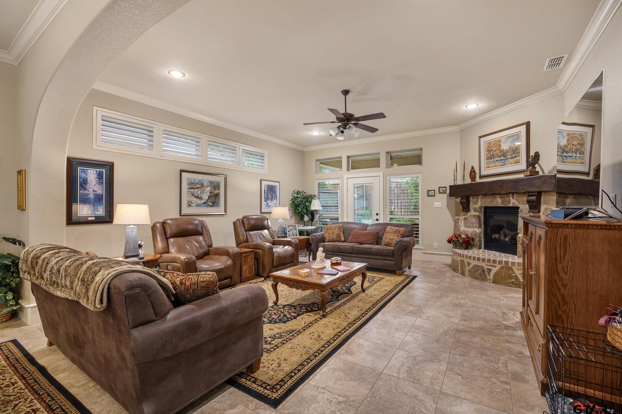 4322 Madera Drive Tyler, TX 75707 - Photo 17 of 32 a living room with furniture large window and a fireplace