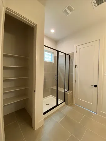 a view of an empty room with a glass door