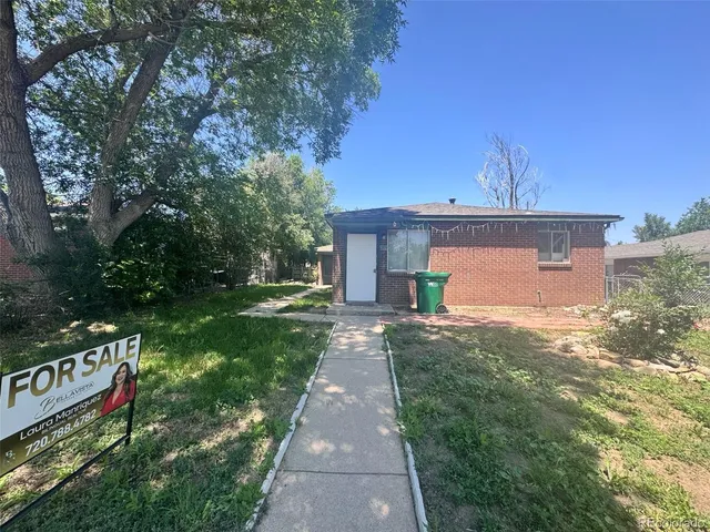 a view of a street with a tree in the background