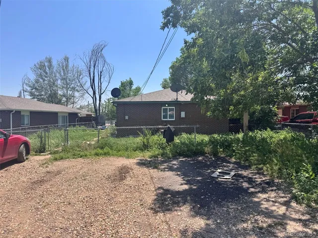 a front view of a house with a yard and a garage