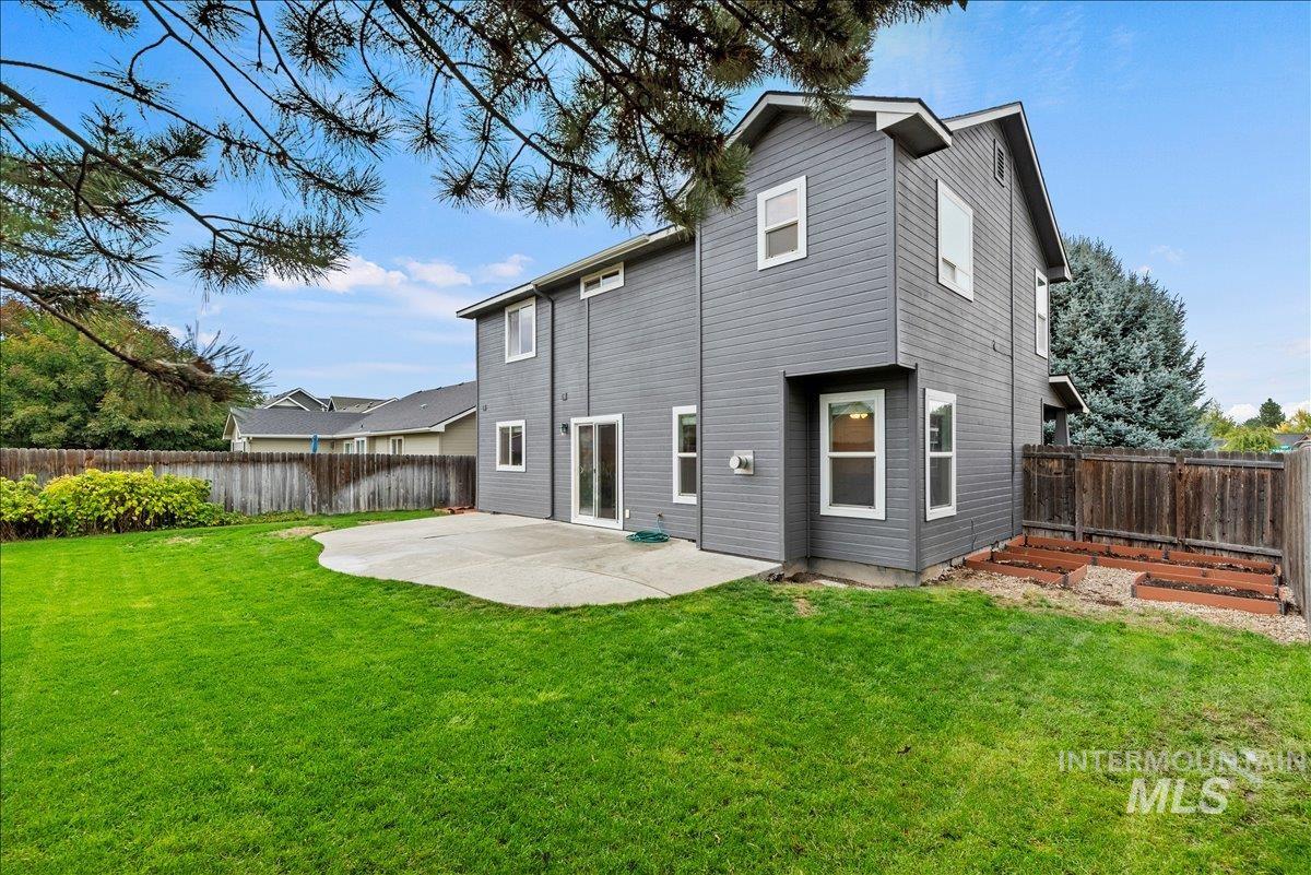 12293 West Murchison Street Boise, ID 83709 - Photo 26 of 27 Rear view of property featuring a patio area, a fenced backyard, and a deck