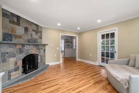 a spacious bedroom with a bed and a fireplace