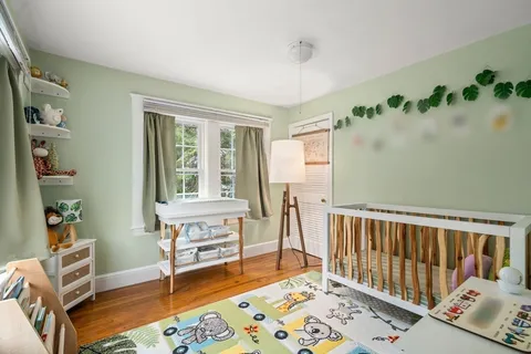 a bedroom with furniture and a window