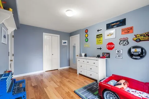 a bedroom with a bed and cabinets