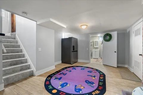 a view of a hallway with windows and entryway