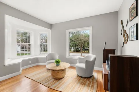 a living room with furniture and a window