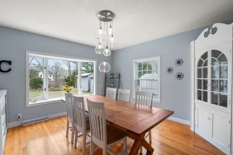 a view of a dining room with furniture window and outside view
