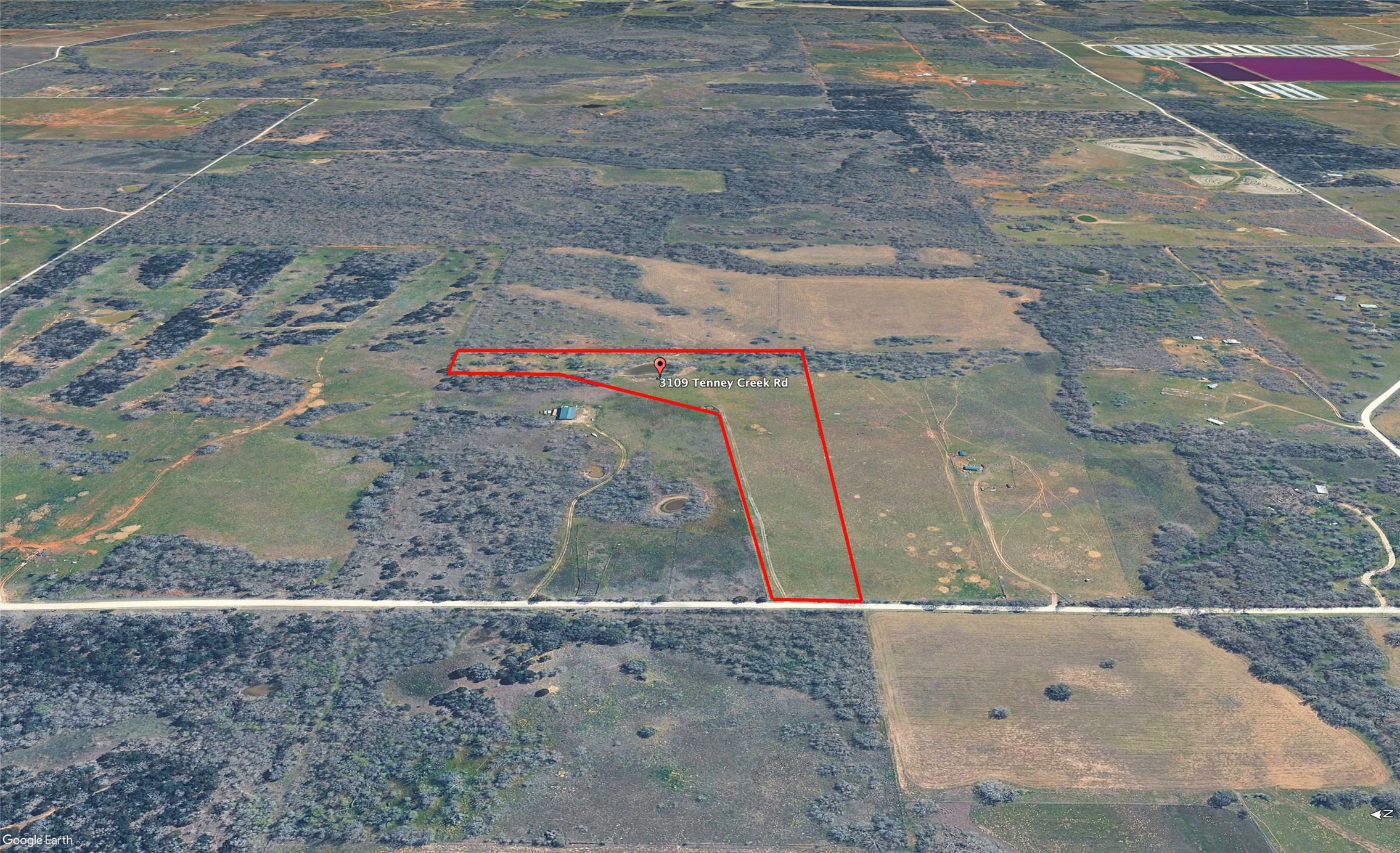 3109 Tenney Creek Road Dale, TX 78616 - Photo 10 of 23 An aerial view showcases a verdant lot with extensive acreage and potential for development.