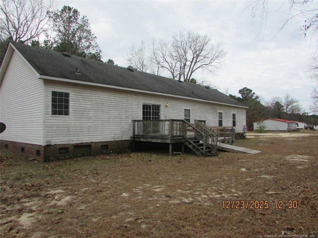 1807 Horseshoe Bend Road Erwin, NC 28339 - Photo 2 of 12 a view of a house with backyard