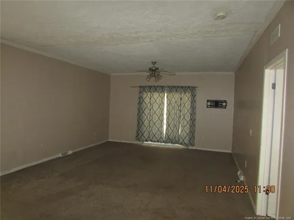 an empty room with windows and entrance