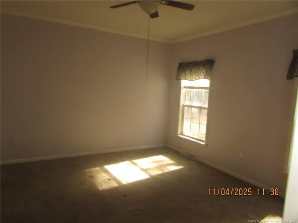 a view of empty room with windows