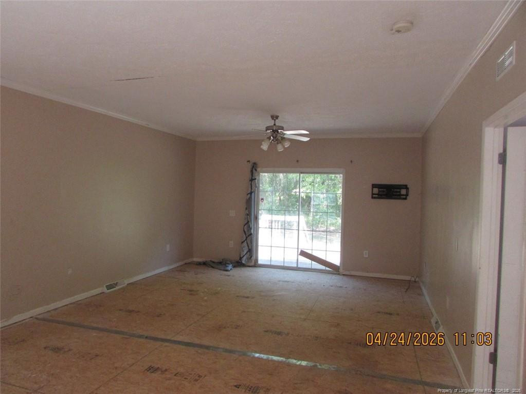 1807 Horseshoe Bend Road Erwin, NC 28339 - Photo 8 of 12 an empty room with a window