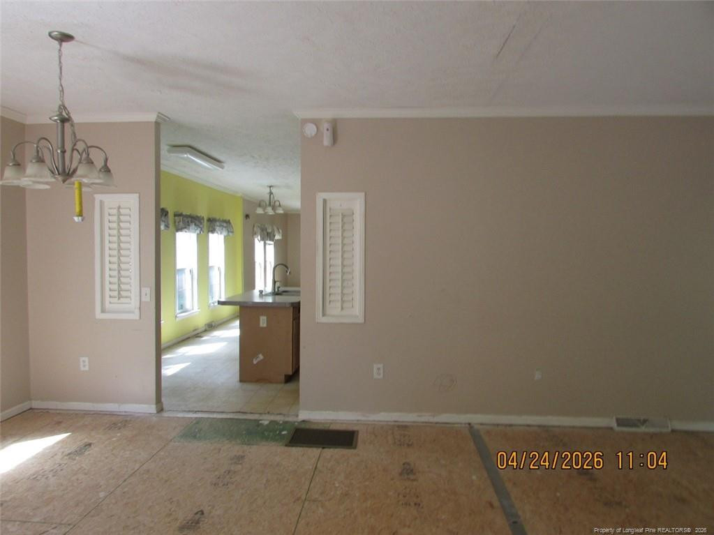 1807 Horseshoe Bend Road Erwin, NC 28339 - Photo 9 of 12 a view of an empty room with a window