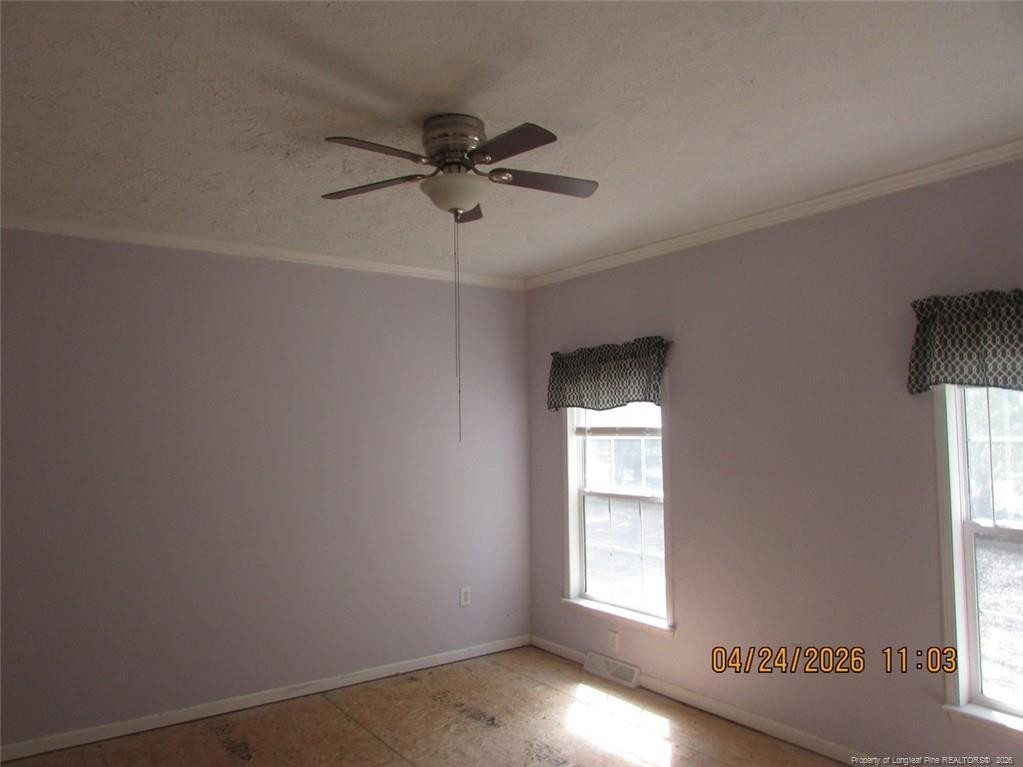 1807 Horseshoe Bend Road Erwin, NC 28339 - Photo 10 of 12 a view of an empty room with a window