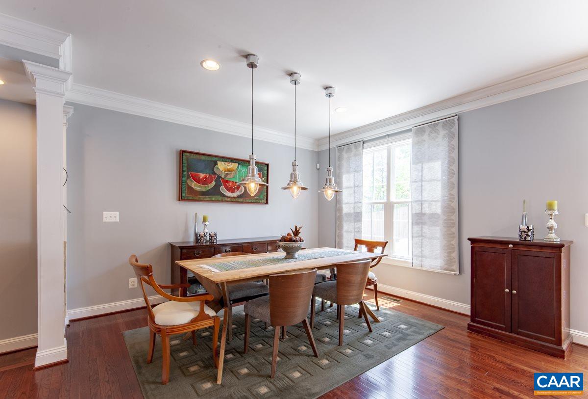 2140 Avinity Loop Charlottesville, VA 22902 - Photo 12 of 26 a view of a dining room with furniture window and wooden floor