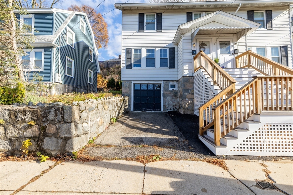 22 Potomac Street, Unit 22 Boston, MA 02132 - Photo 1 of 12 a front view of a brick house with many windows