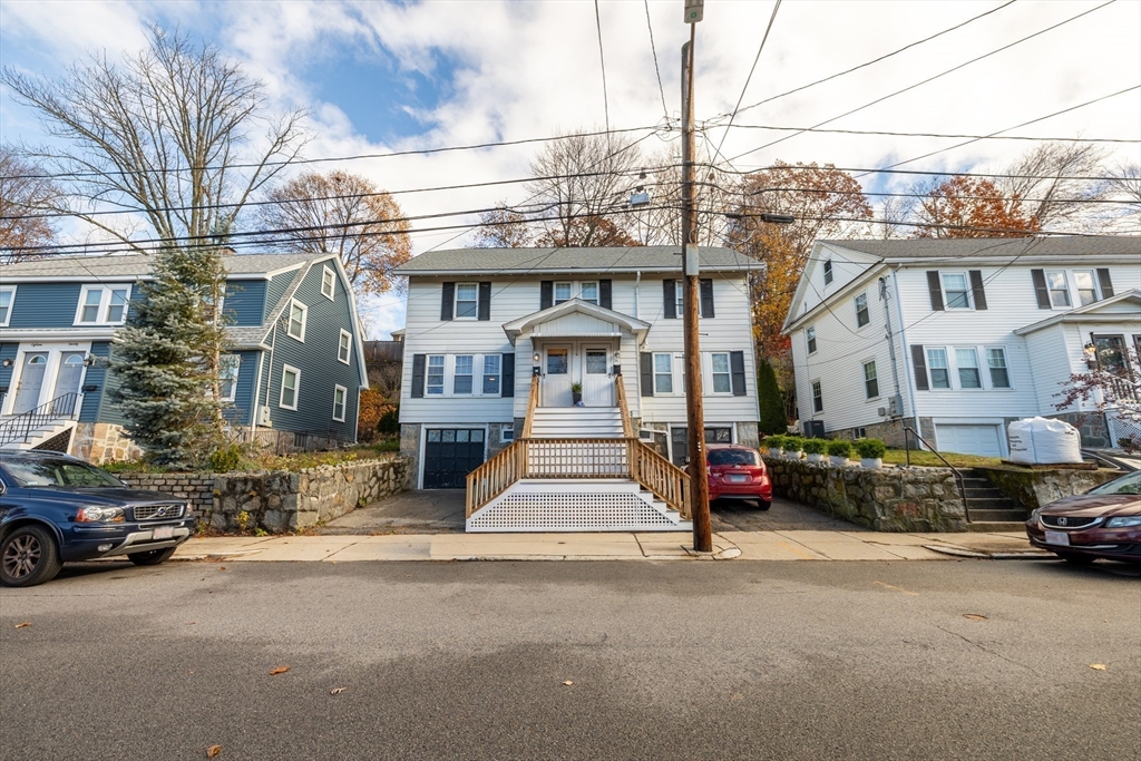 22 Potomac Street, Unit 22 Boston, MA 02132 - Photo 12 of 12 a front view of a building with cars parked