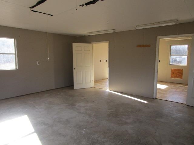 918 Fleeburg Loop Shenandoah, VA 22849 - Photo 22 of 40 an empty room with windows and entrance to other room