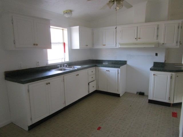 918 Fleeburg Loop Shenandoah, VA 22849 - Photo 27 of 40 a kitchen with granite countertop white cabinets and sink
