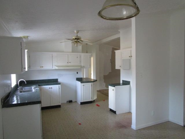 918 Fleeburg Loop Shenandoah, VA 22849 - Photo 28 of 40 a kitchen with stainless steel appliances a stove refrigerator and white cabinets
